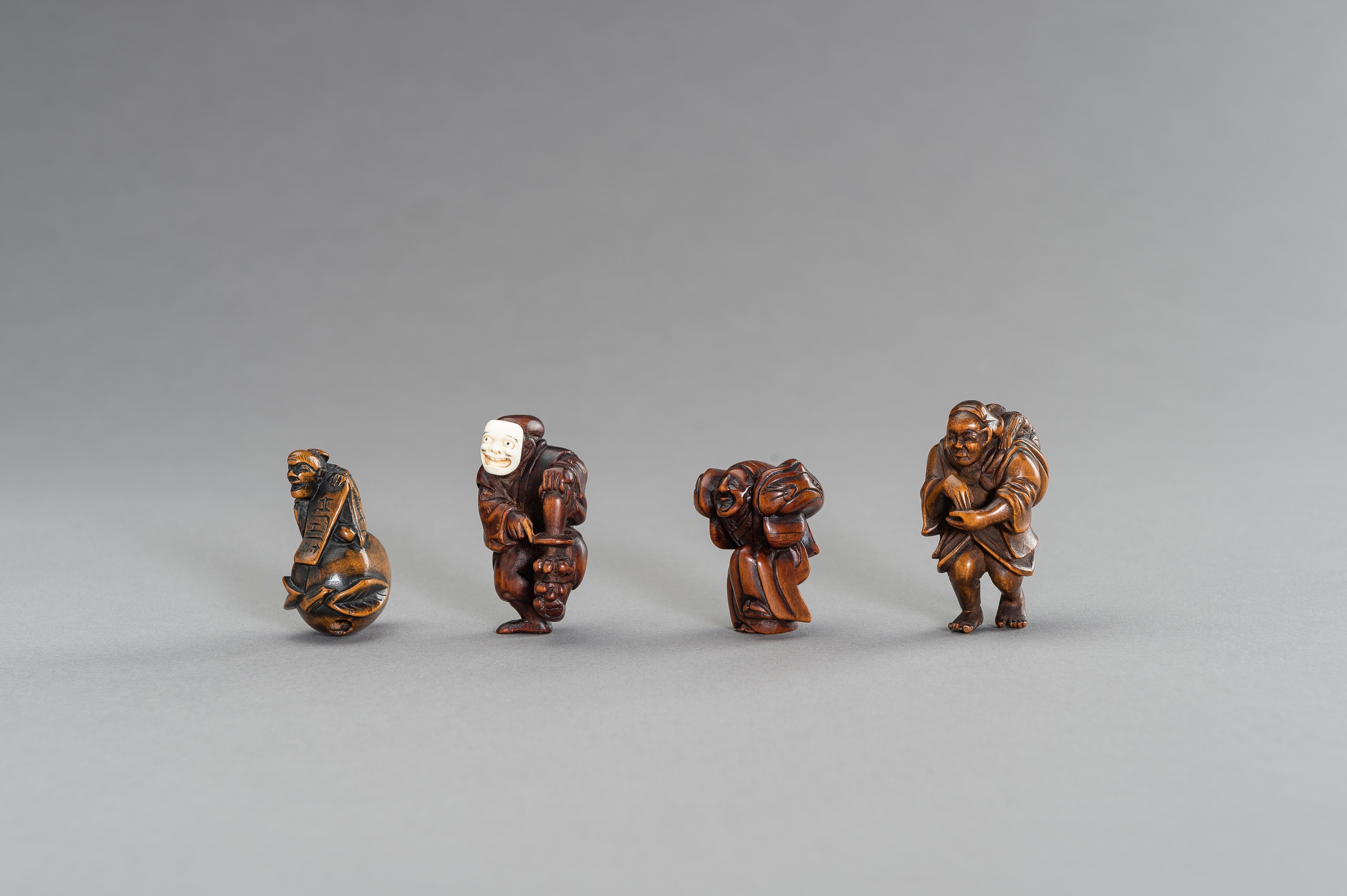 A GROUP OF FOUR FIGURAL WOOD NETSUKE - Image 3 of 3