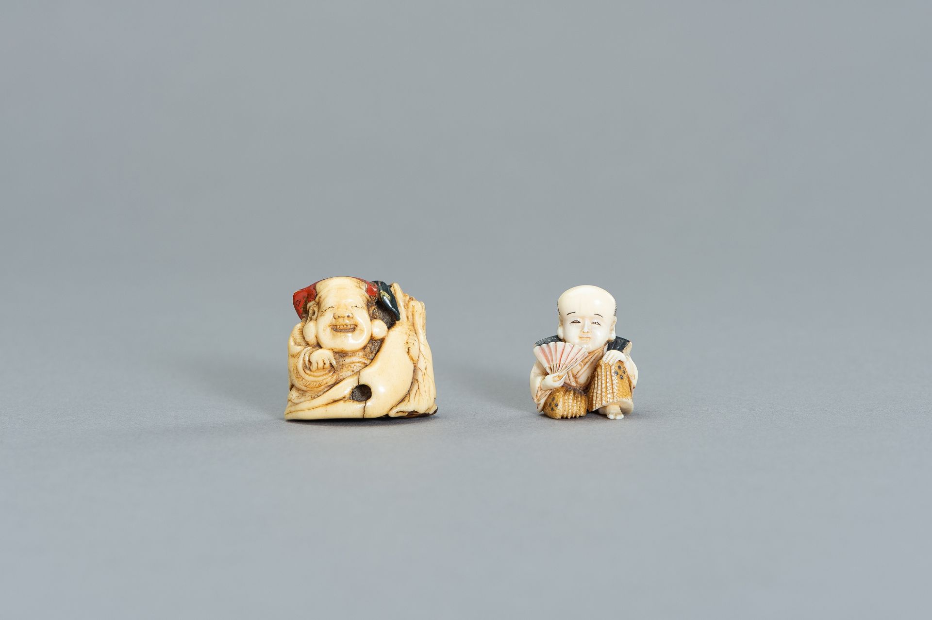 A GROUP OF TWO PAINTED IVORY NETSUKE