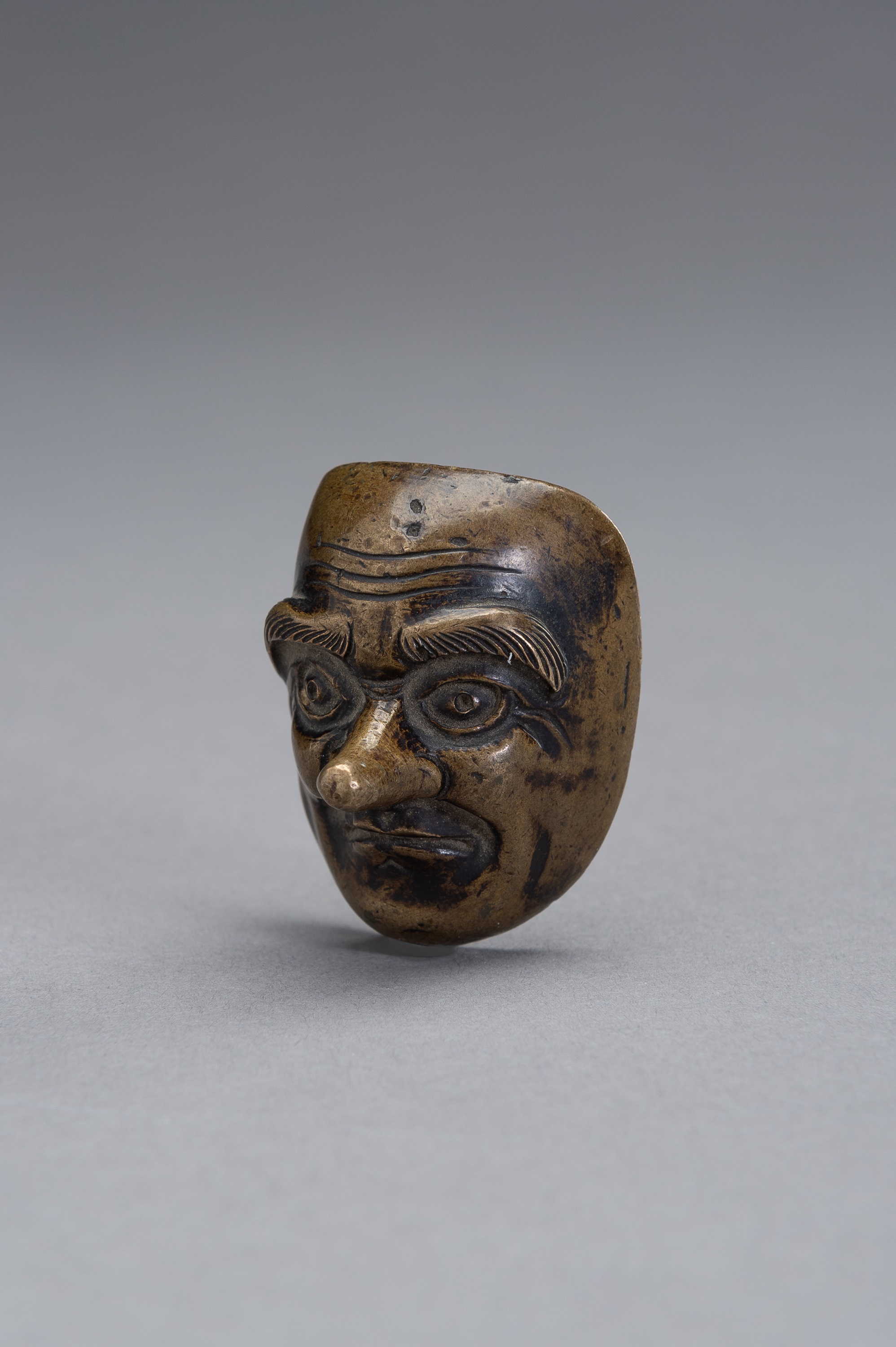A BRONZE SCROLL WEIGHT IN THE SHAPE OF A NOH MASK - Image 3 of 9