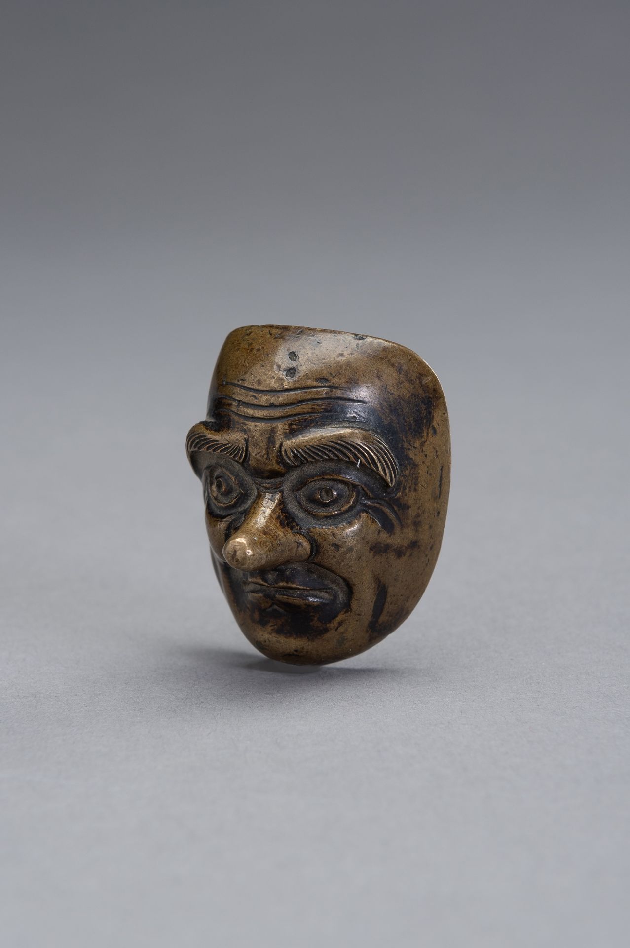 A BRONZE SCROLL WEIGHT IN THE SHAPE OF A NOH MASK - Image 3 of 9