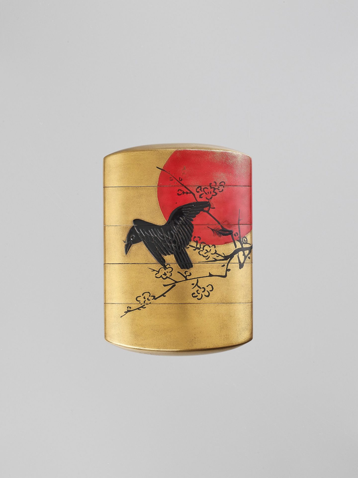 ZESHIN: A LACQUER FOUR-CASE INRO DEPICTING A CROW AGAINST A RED MOON