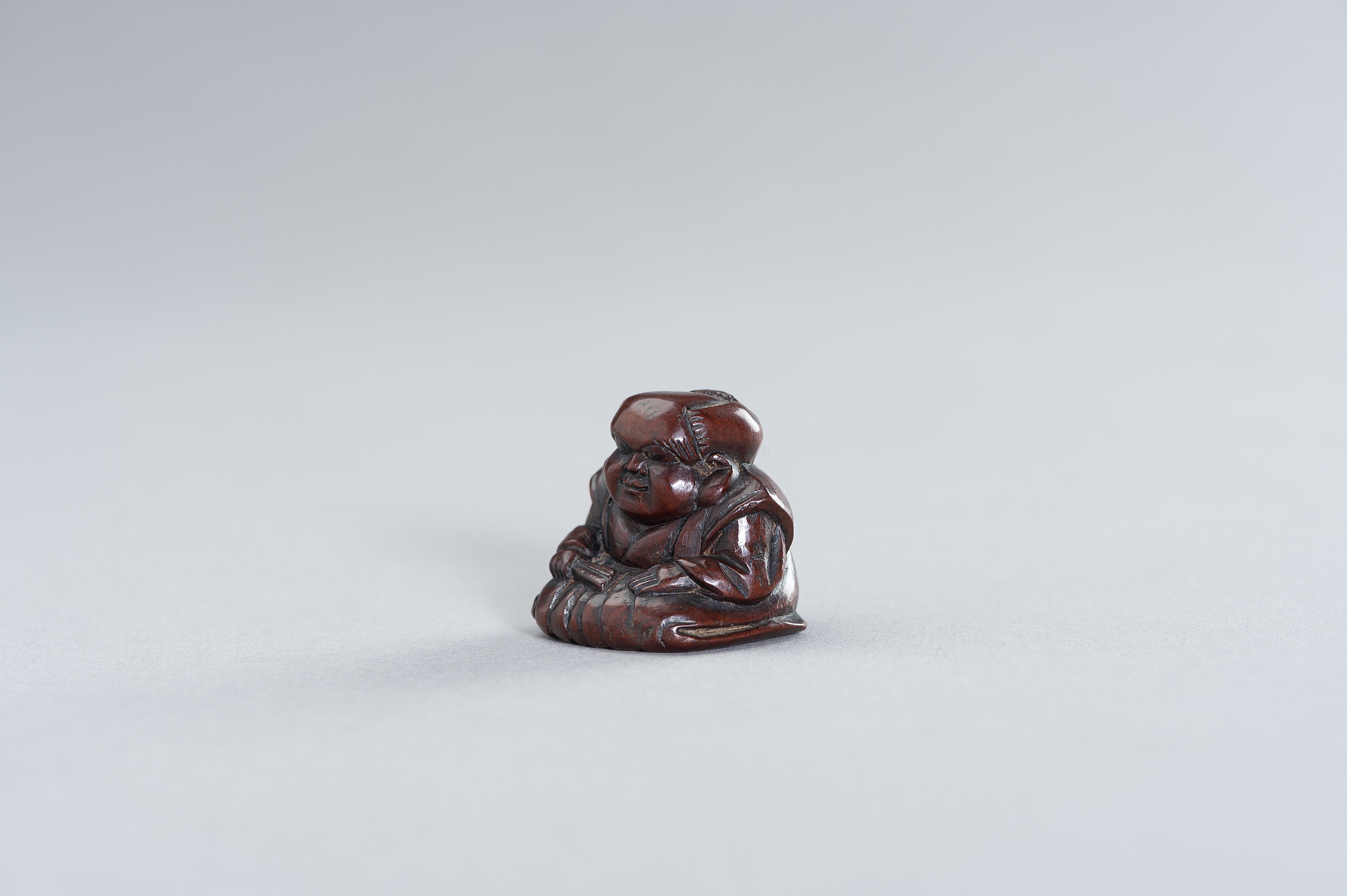 A WOOD NETSUKE OF FUKUSUKE - Image 2 of 3