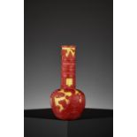 A CARVED RED-OVERLAY YELLOW GLASS BOTTLE VASE, QIANLONG MARK AND PERIOD