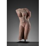 A RED SANDSTONE TORSO OF A LADY, 10TH CENTURY