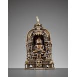 A JAIN COPPER AND SILVER-INLAID BRASS SHRINE TO PARSHVANATHA, DATED 1411 AD