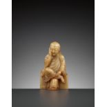A SOAPSTONE FIGURE OF A PENSIVE IMMORTAL, QING DYNASTY