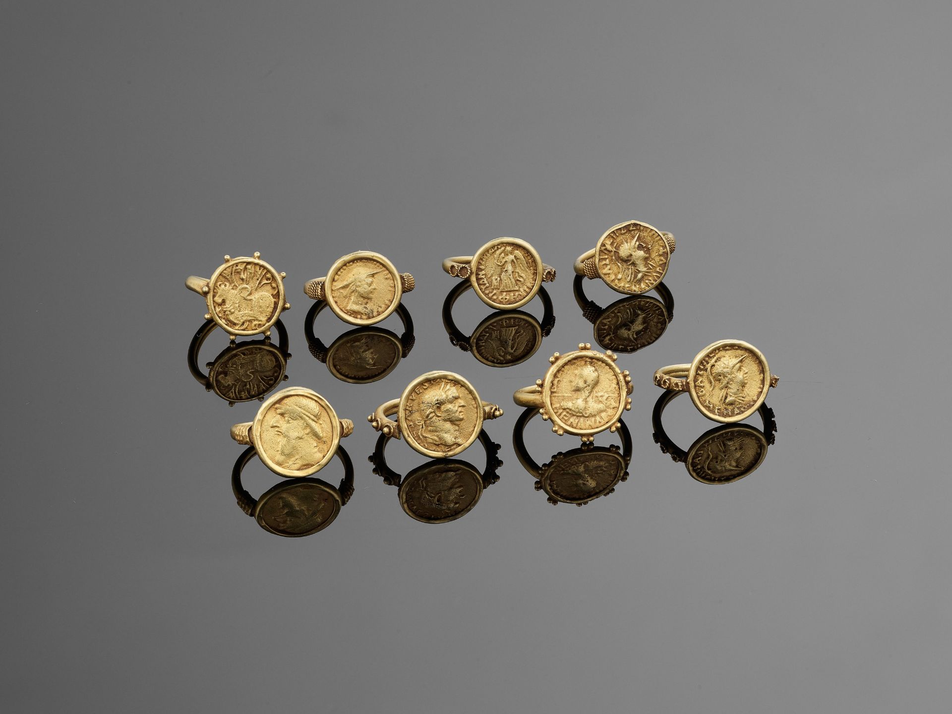 A SET OF EIGHT ANCIENT GANDHARA COIN GOLD RINGS