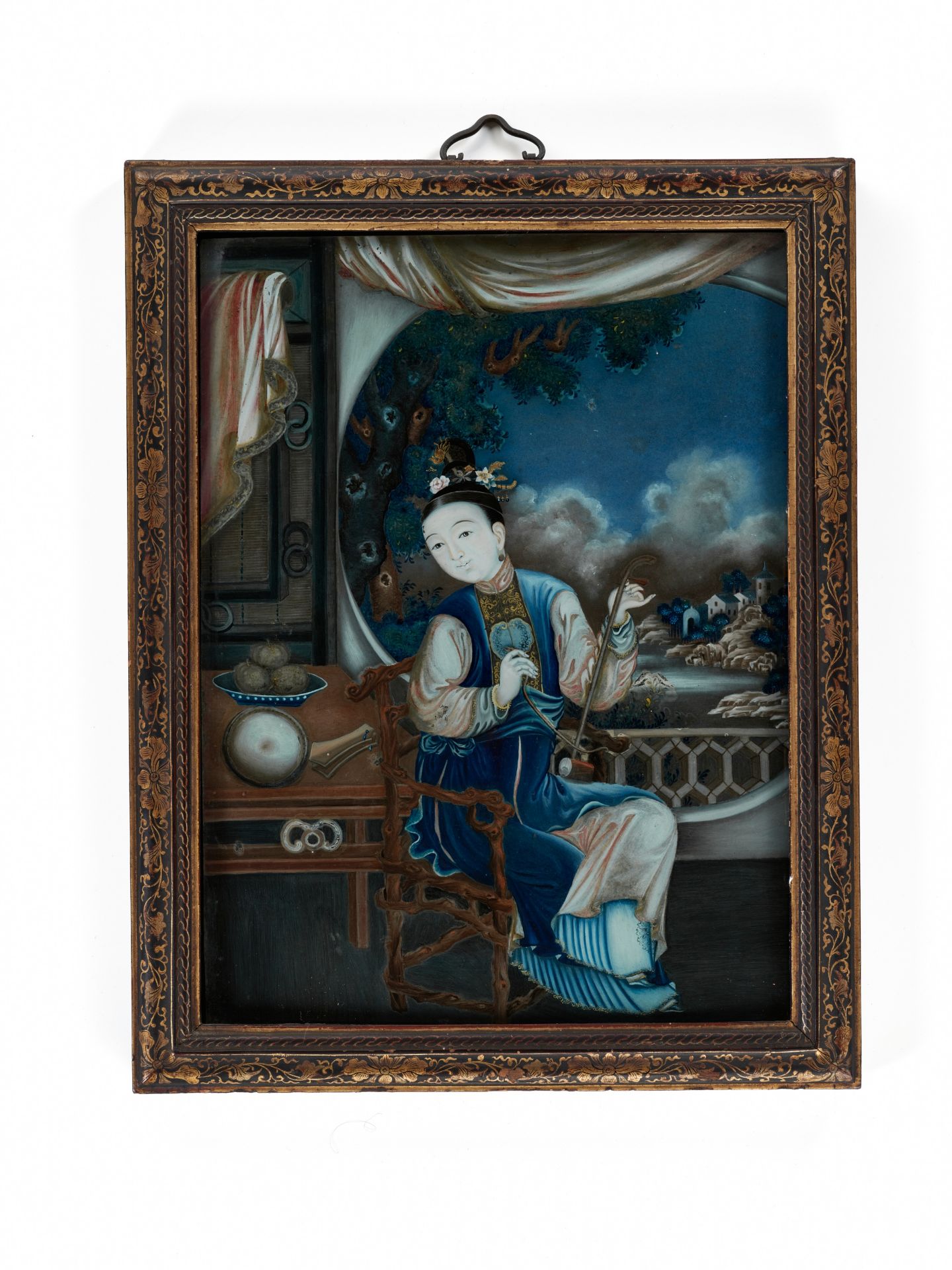 A REVERSE-GLASS PAINTING OF A LADY PLAYING THE HUQIN, QING DYNASTY