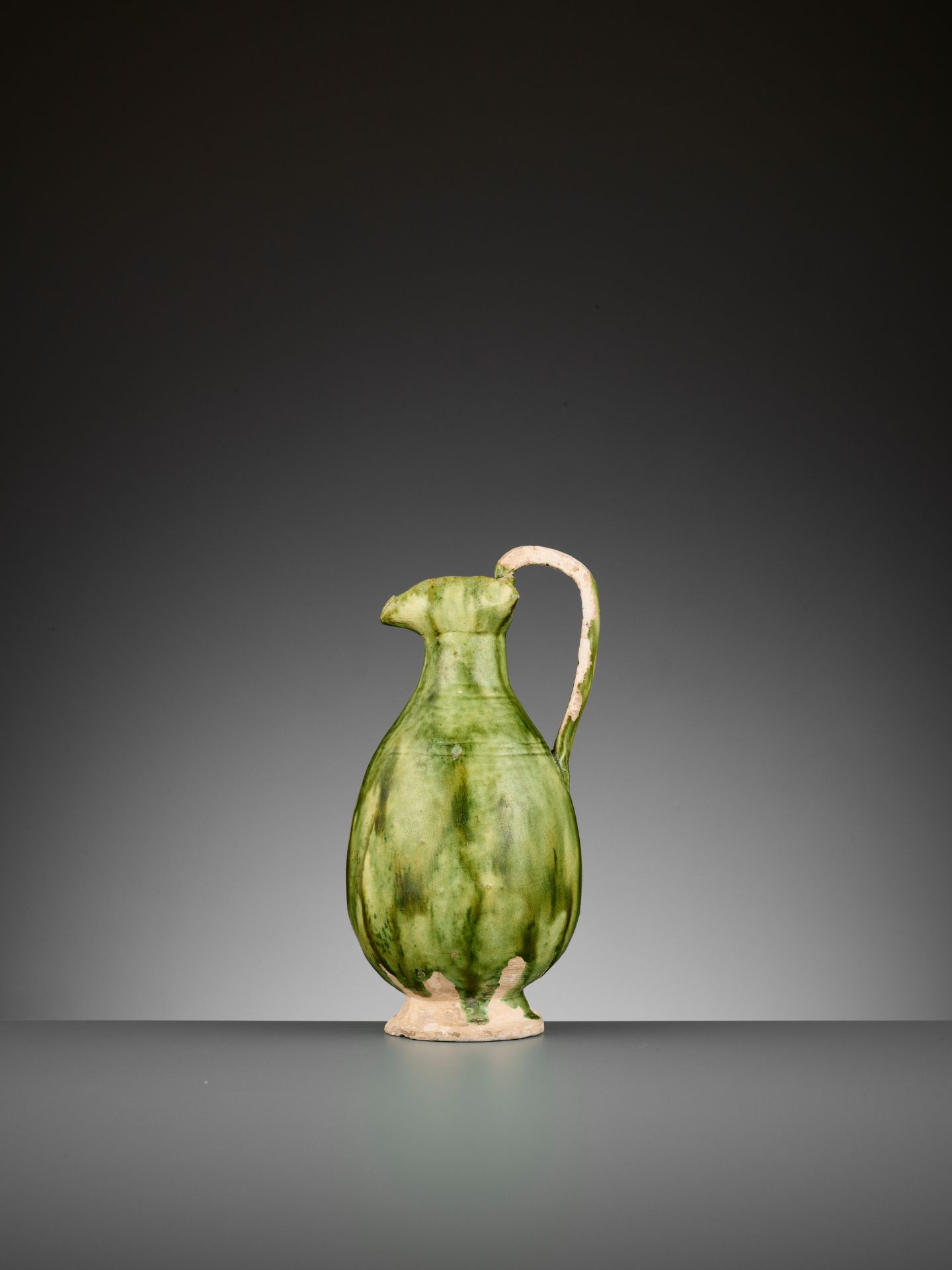 A GREEN-GLAZED EWER, TANG DYNASTY - Image 2 of 9