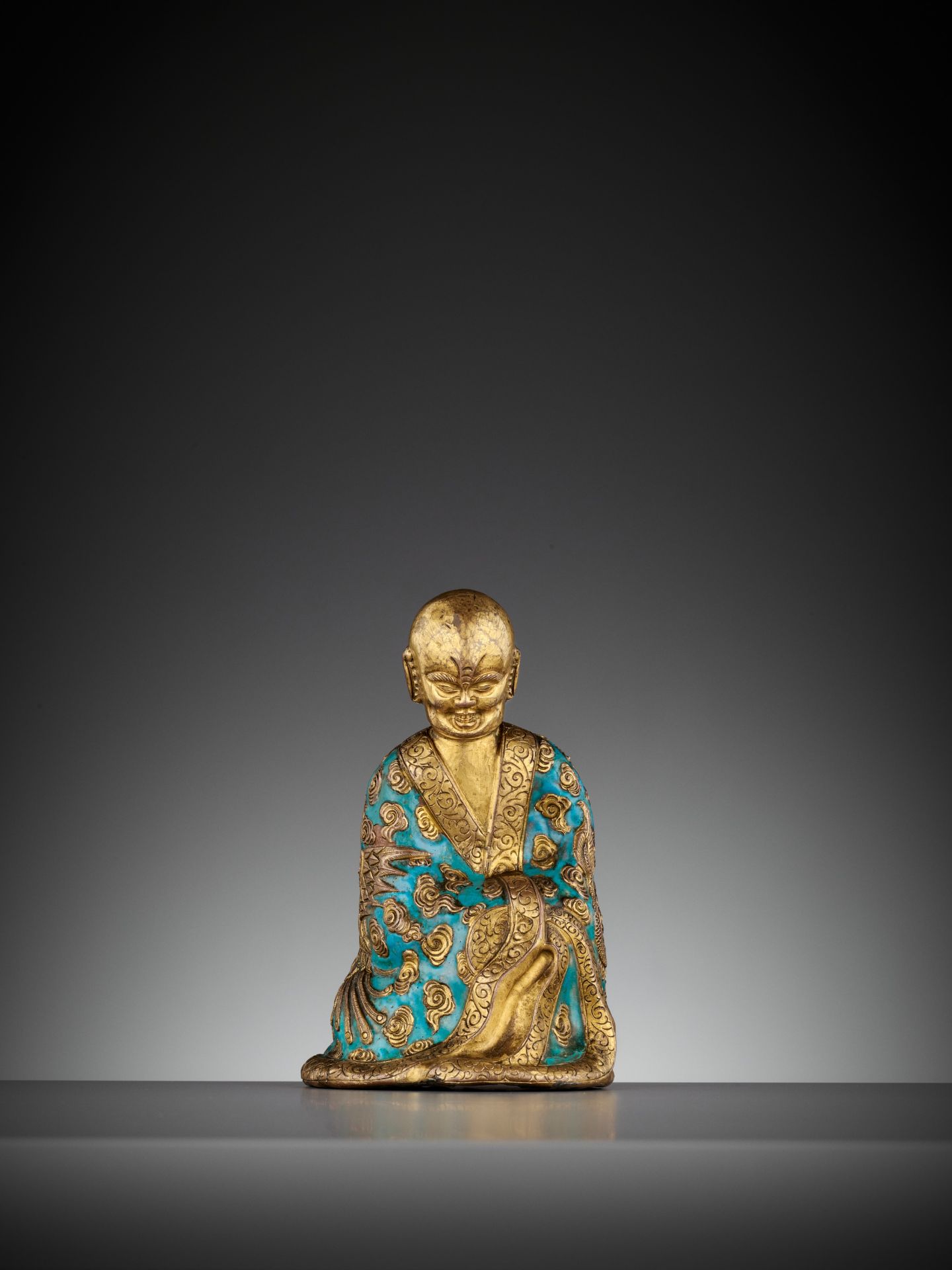 AN ENAMELED GILT-COPPER REPOUSSE LUOHAN, QIANLONG MARK AND PERIOD - Image 3 of 12