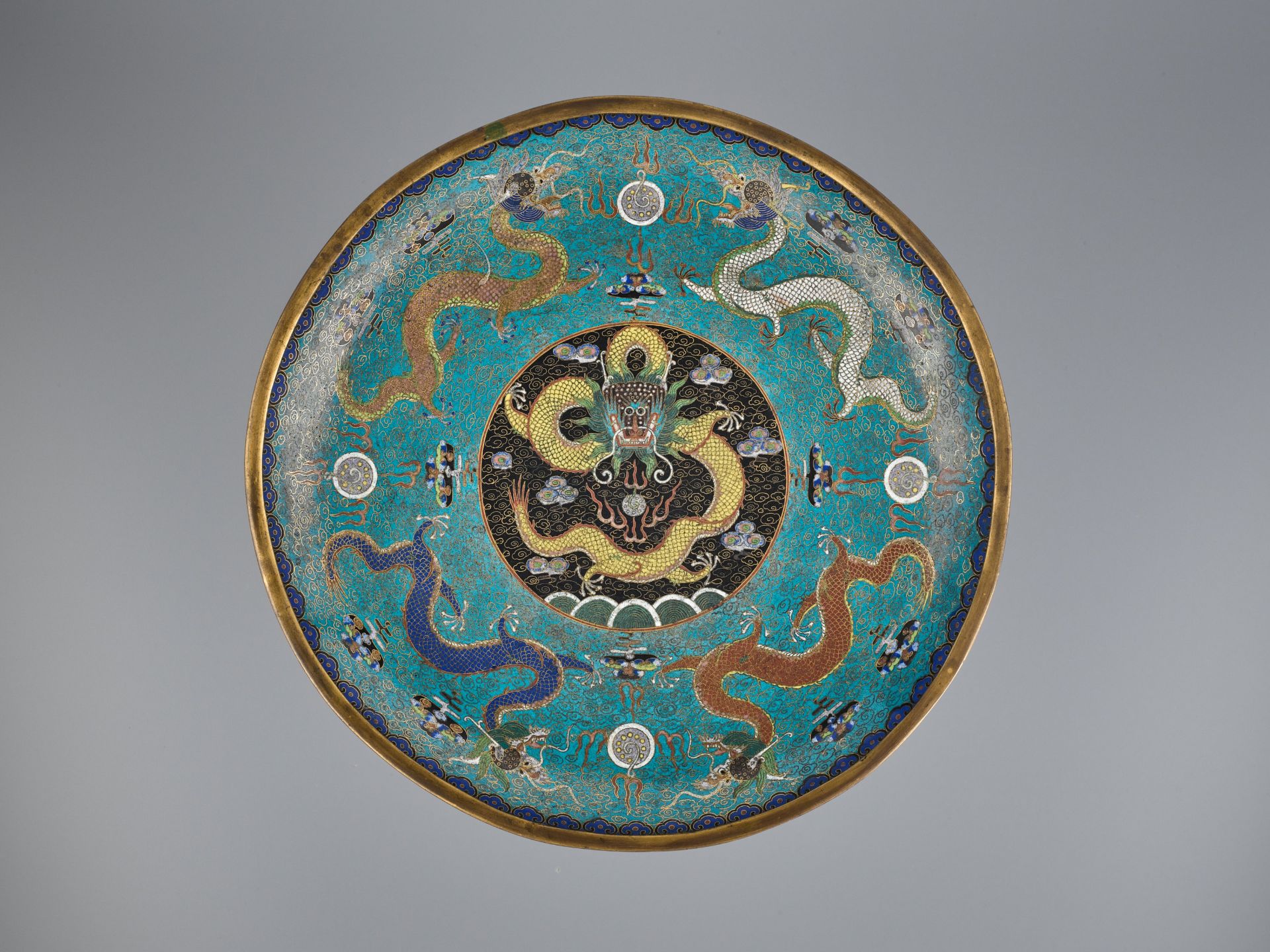 A LARGE GILT-BRONZE CLOISONNE ENAMEL 'DRAGON' DISH, QING DYNASTY