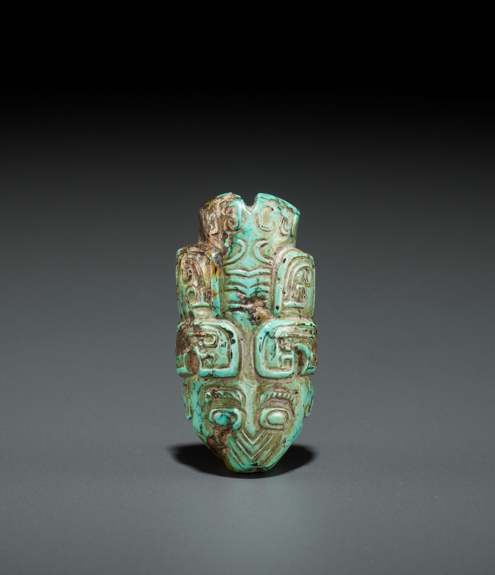 A TURQUOISE BEAD DEPICTING A CICADA, SHANG TO WESTERN ZHOU DYNASTY