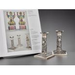 A PAIR OF RETICULATED SILVER CANDLESTICKS, WANG HING, LATE QING DYNASTY