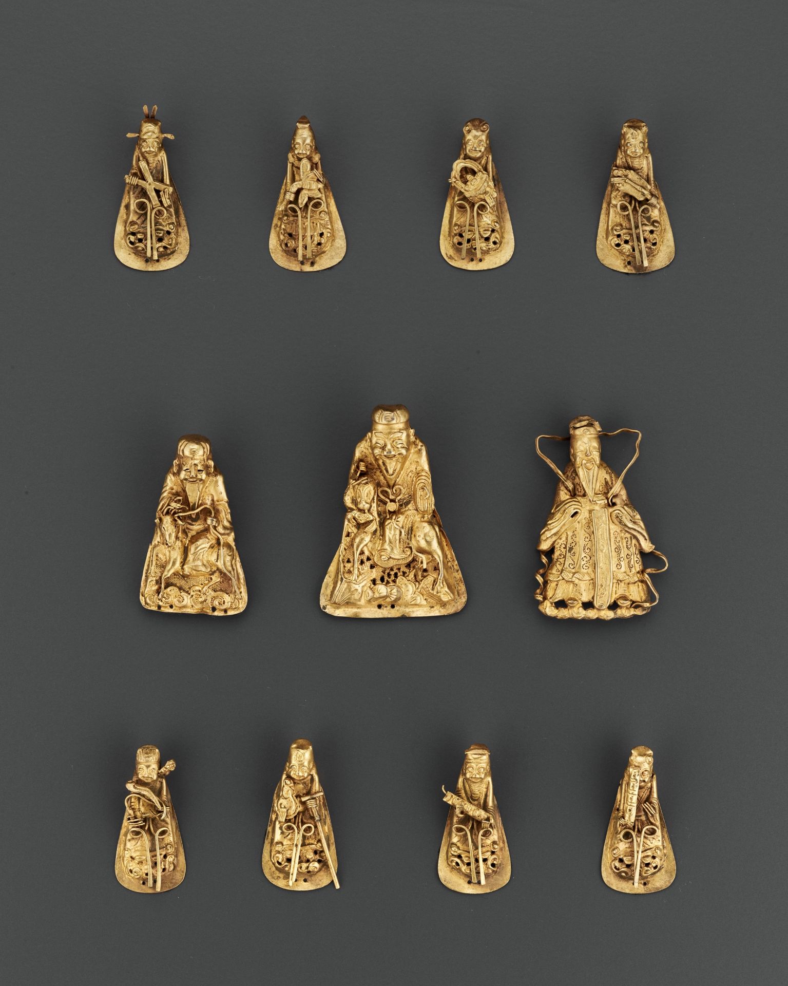 A SET OF ELEVEN GILT SILVER REPOUSSE HEADDRESS ORNAMENTS, QING OR EARLIER