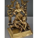 A BRASS SHRINE DEPICTING DURGA SLAYING THE BUFFALO