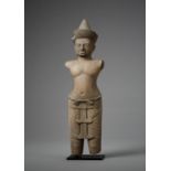 A KHMER SANDSTONE FIGURE OF A MALE DEITY, ANGKOR PERIOD