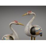 A PAIR OF GILT BRONZE AND CLOISONNE ENAMEL FIGURES OF CRANES, QING DYNASTY