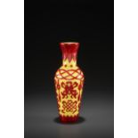 A RED-OVERLAY YELLOW GLASS 'BAJIXIANG' VASE, MID-QING