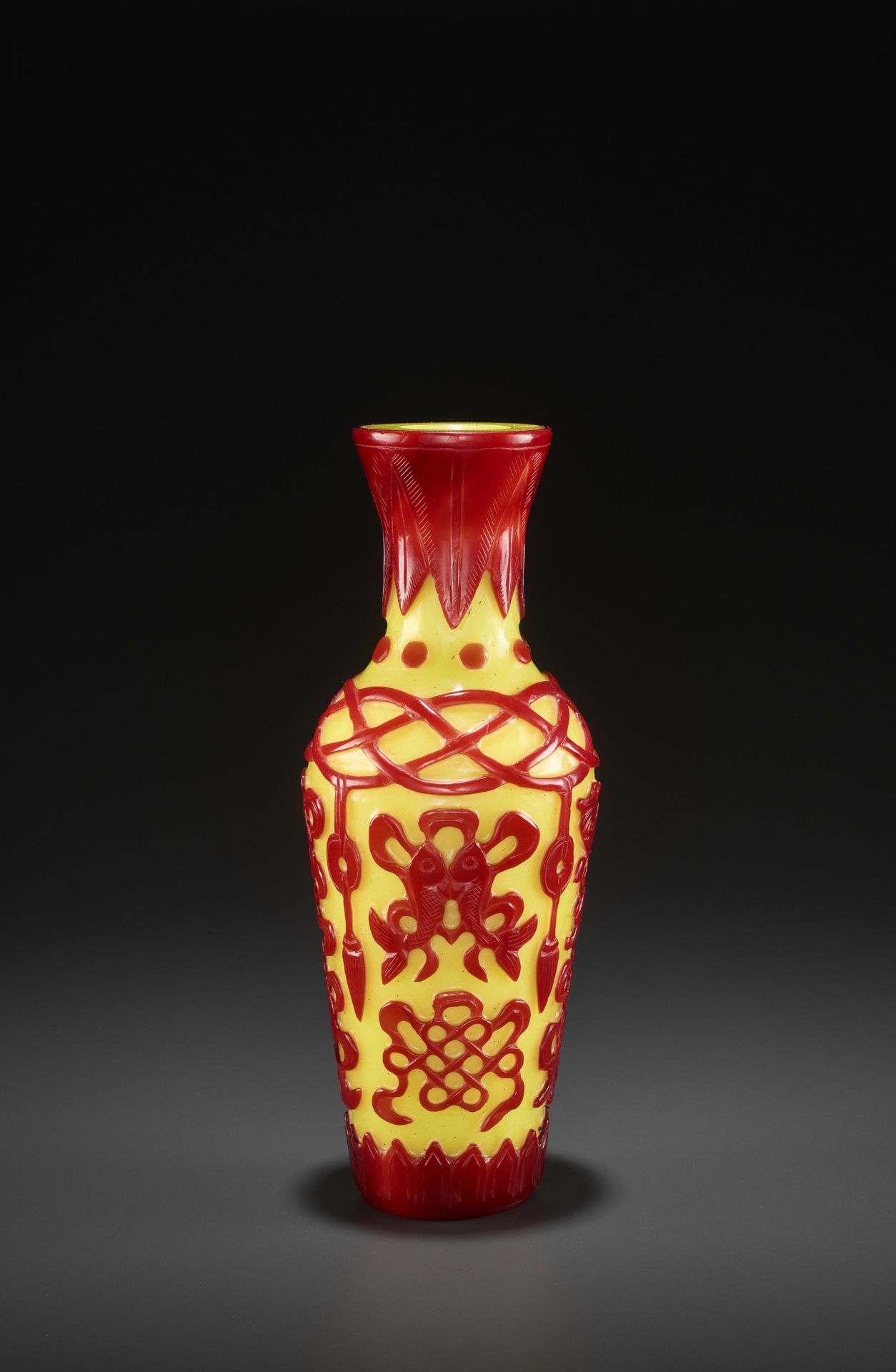 A RED-OVERLAY YELLOW GLASS 'BAJIXIANG' VASE, MID-QING