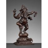 A SILVER-INLAID BRONZE FIGURE OF GANESHA DANCING, 18TH-19TH CENTURY
