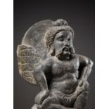 A GRAY SCHIST FIGURE OF A WINGED ATLAS, GANDHARA