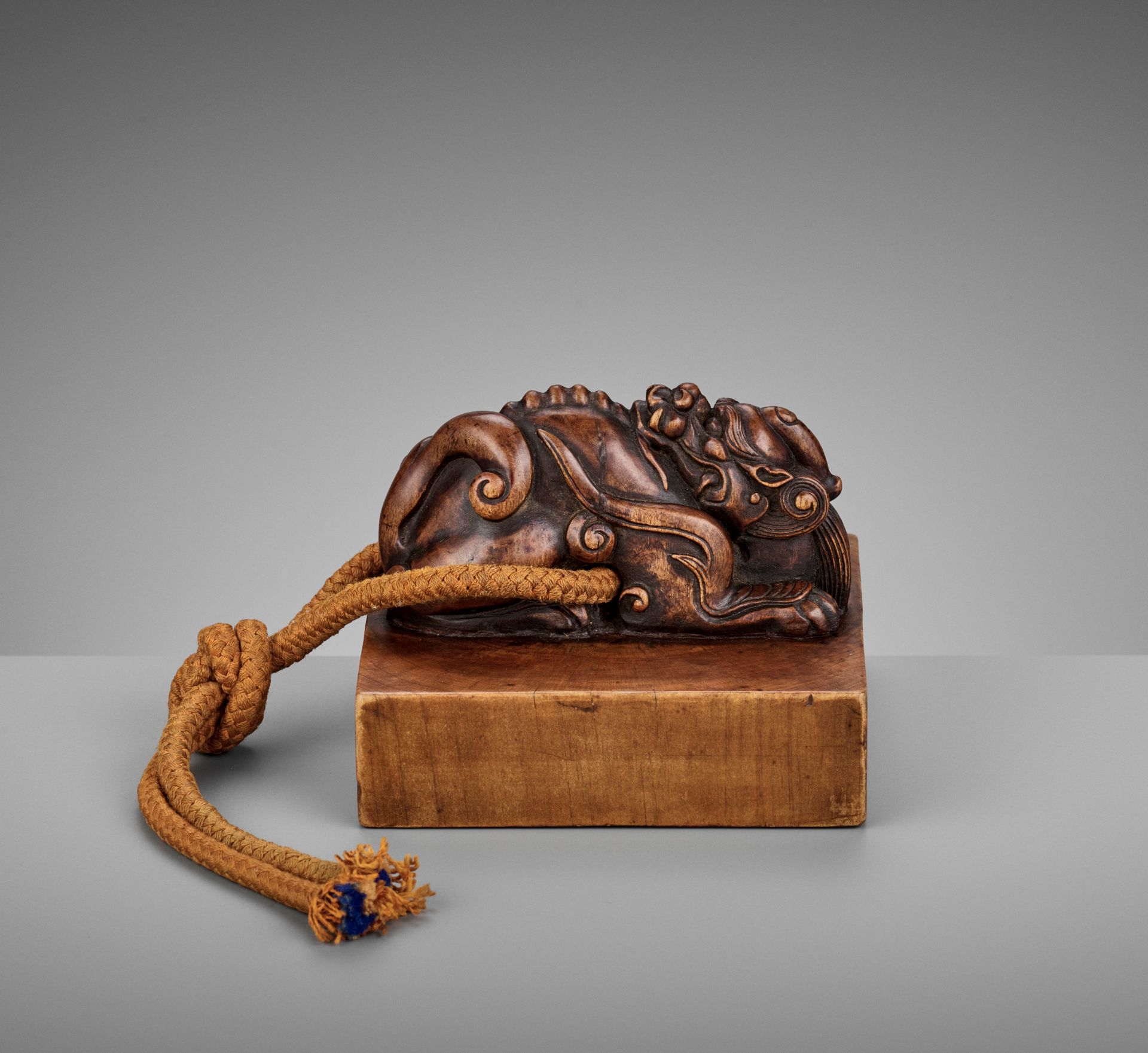 A CARVED SANDALWOOD 'RECUMBENT DRAGON' SEAL, QIANLONG CHENHAN