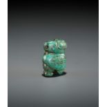 A TURQUOISE MATRIX PENDANT DEPICTING AN OWL, LATE SHANG DYNASTY