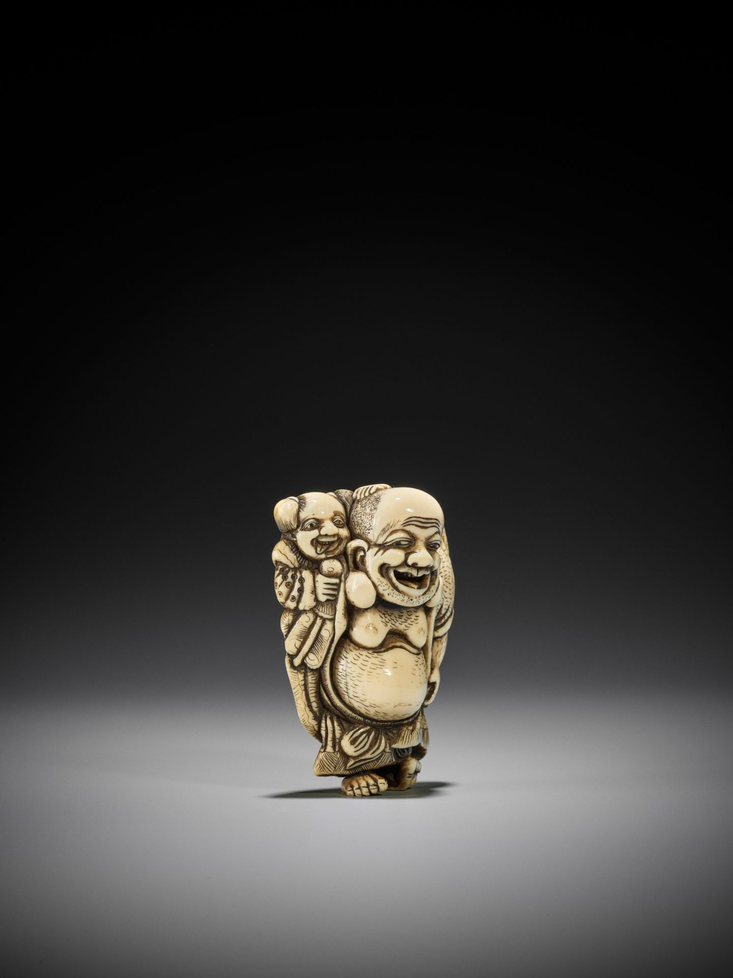 TOZAN: A SUPERB AND LARGE IVORY NETSUKE OF HOTEI WITH KARAKO - Image 10 of 16