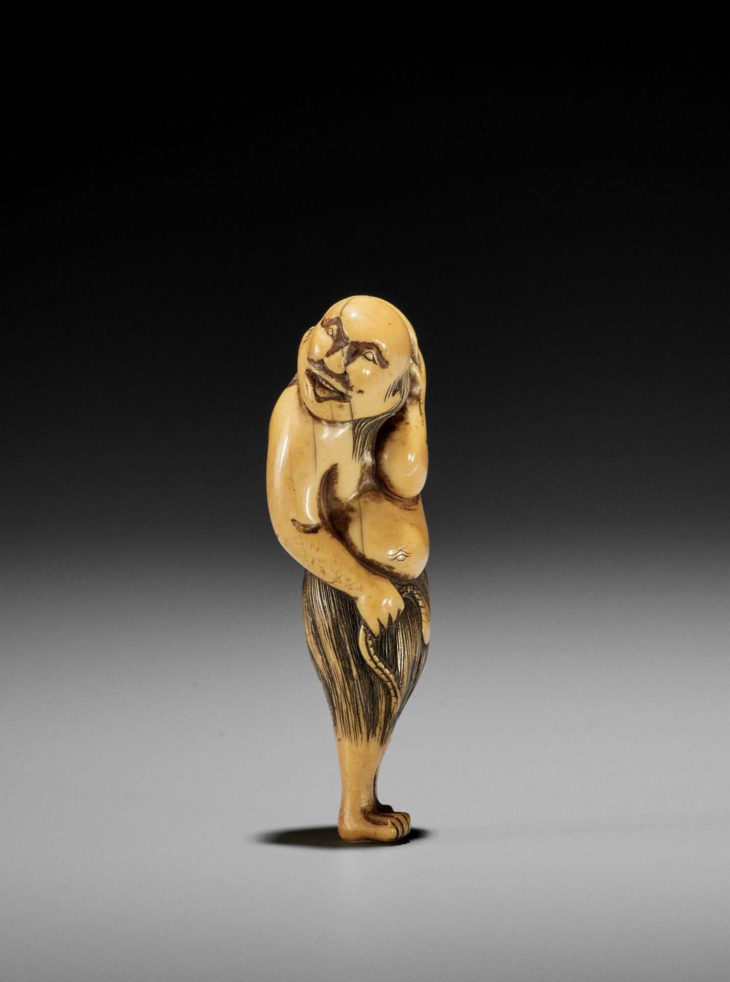 A RARE NETSUKE OF A MALE AWABI DIVER