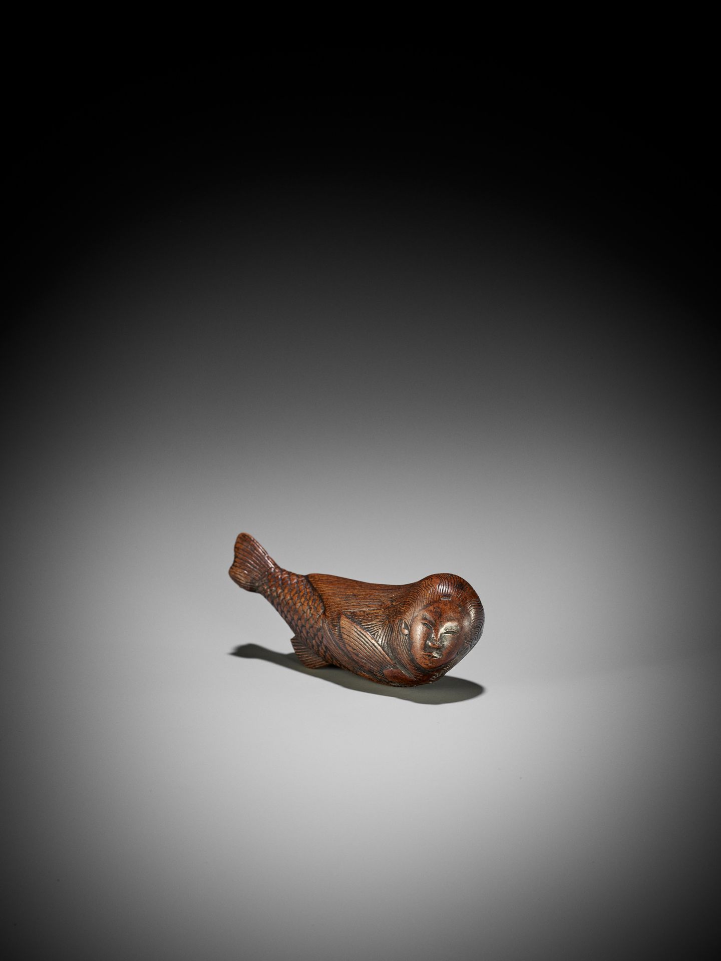 AN UNUSUAL WOOD NETSUKE OF A SWIMMING NINGYO (MERMAID) - Image 2 of 10