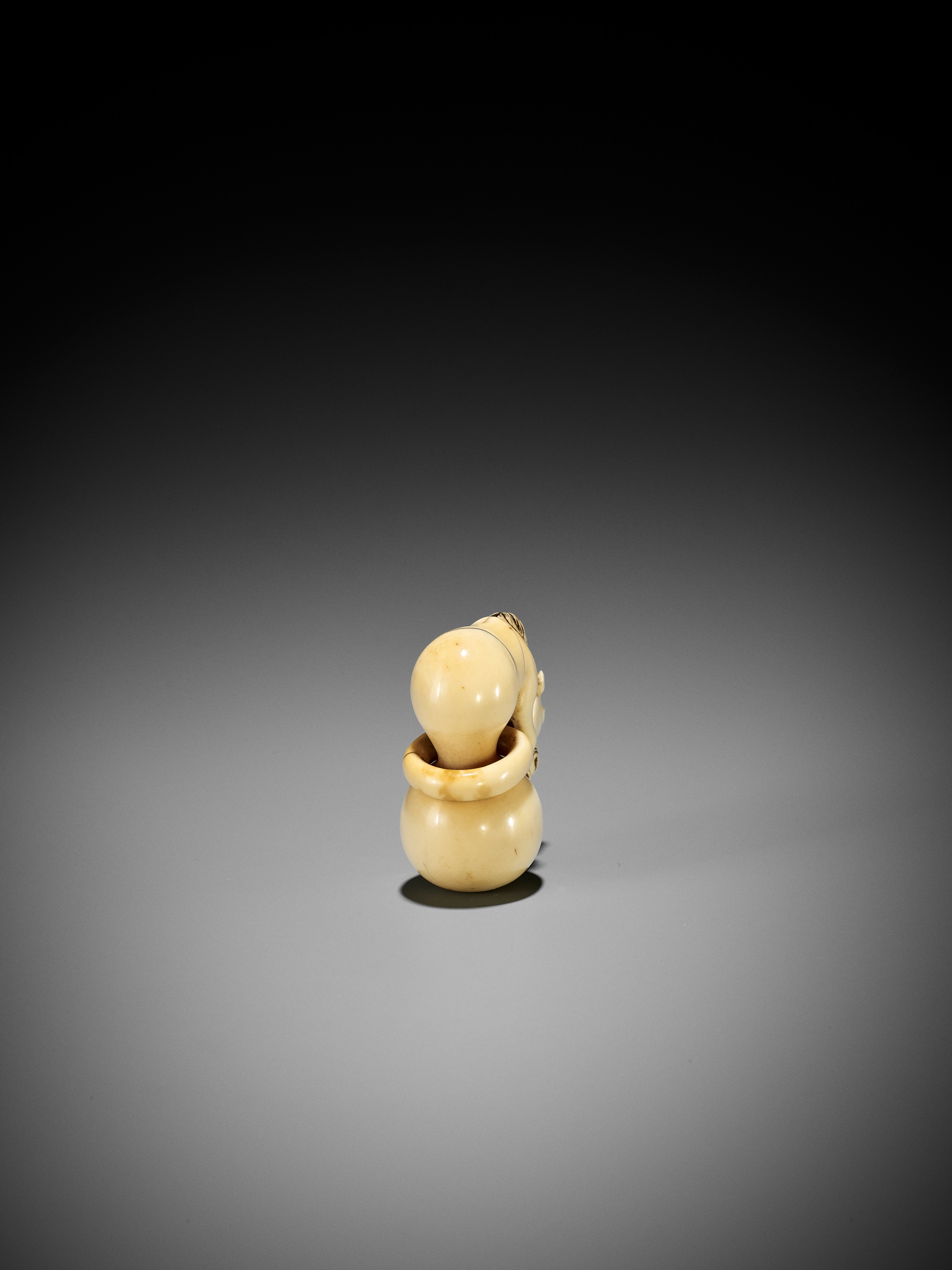 A GOOD IVORY NETSUKE OF CHOKARO'S HORSE EMERGING FROM A DOUBLE GOURD - Image 3 of 10