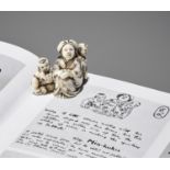 MINKOKU: AN IVORY NETSUKE OF A MOTHER WITH CHILDREN