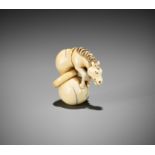 A GOOD IVORY NETSUKE OF CHOKARO'S HORSE EMERGING FROM A DOUBLE GOURD