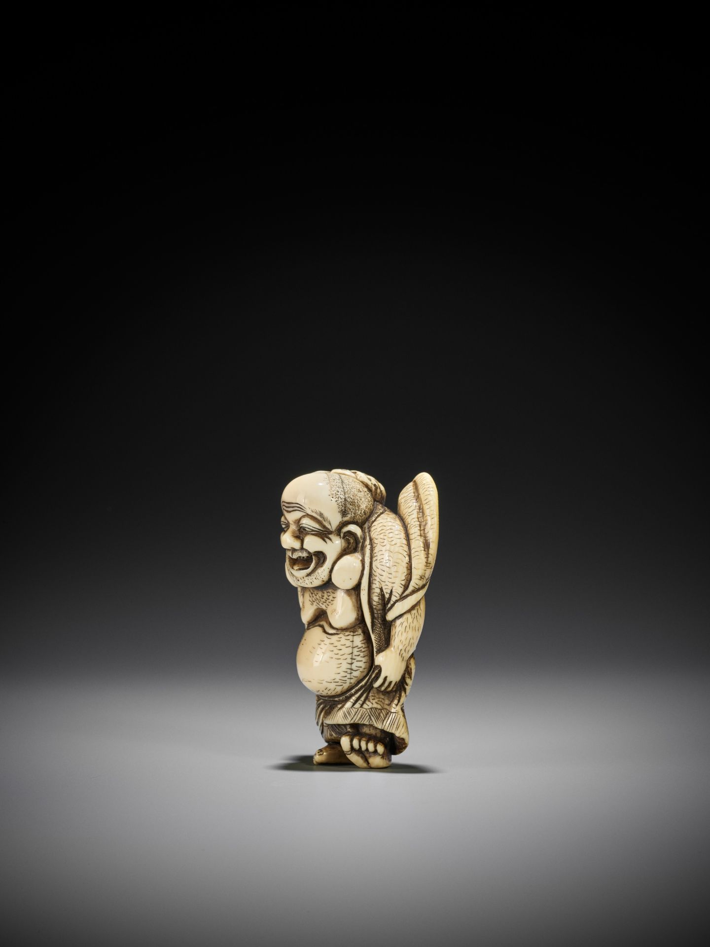 TOZAN: A SUPERB AND LARGE IVORY NETSUKE OF HOTEI WITH KARAKO - Image 8 of 16