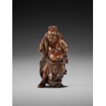 SHUGETSU: A RARE WOOD NETSUKE OF A NIO WITH SANDAL