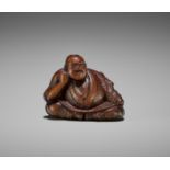 ISSEN: A RARE EDO SCHOOL WOOD NETSUKE OF SOSHI AND BUTTERFLY