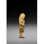 AN IVORY NETSUKE OF A FISHERGIRL (AMA)