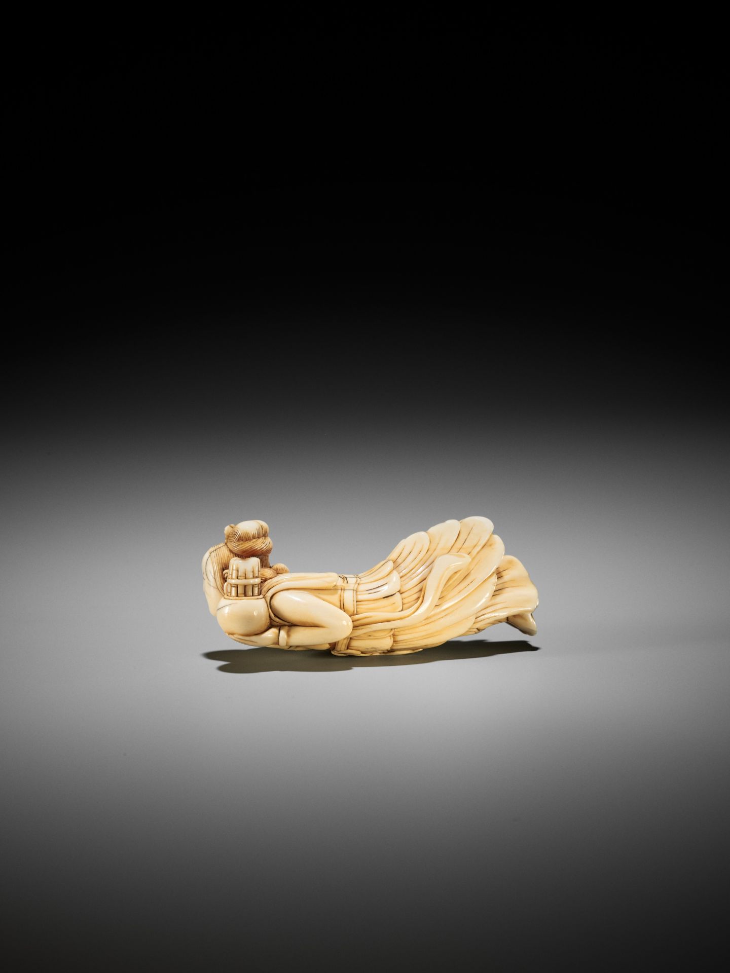 A SUPERB, LARGE AND RARE IVORY NETSUKE OF A TENNIN (BUDDHIST ANGEL) - Image 3 of 6