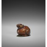 RANKO: A RARE WOOD NETSUKE OF A RAT EMERGING FROM AN EGG