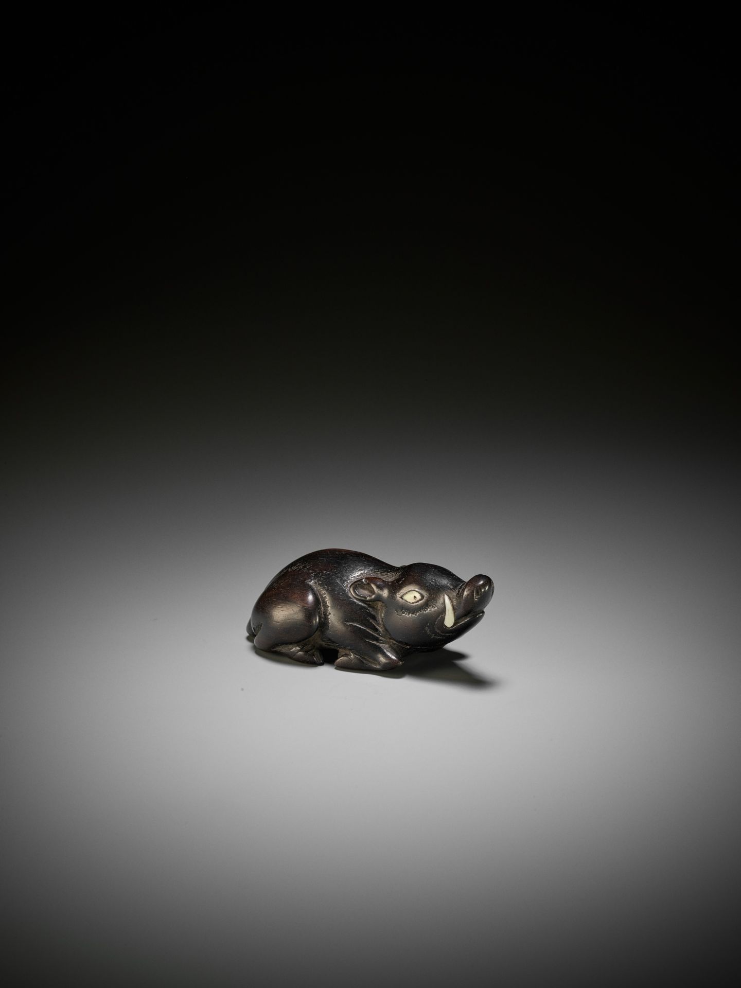 A LARGE AND OLD DARK WOOD NETSUKE OF A RECUMBENT BOAR - Image 2 of 9