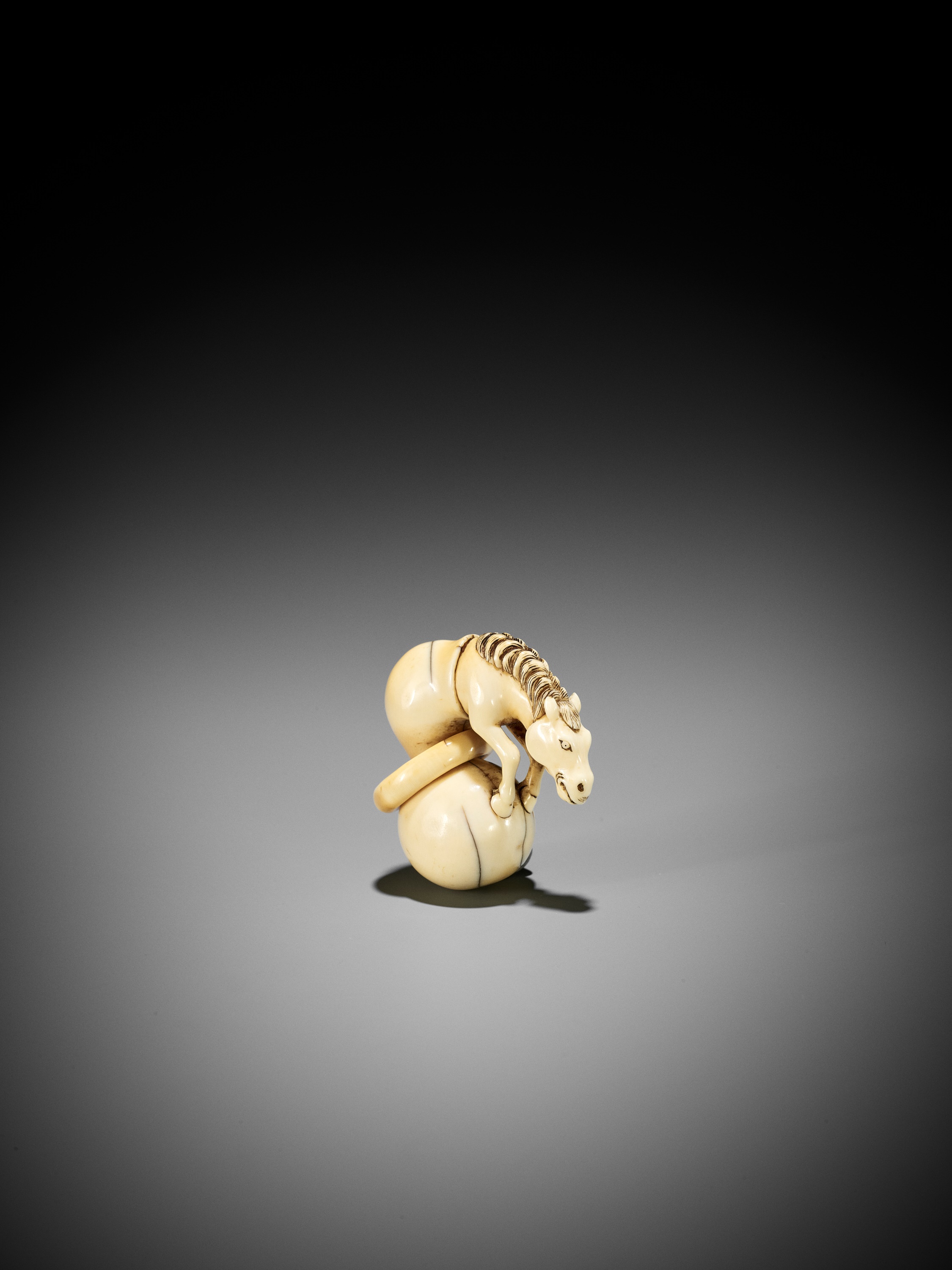 A GOOD IVORY NETSUKE OF CHOKARO'S HORSE EMERGING FROM A DOUBLE GOURD - Image 2 of 10