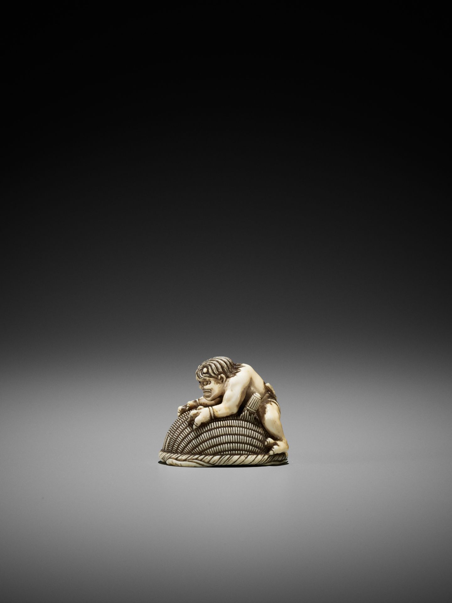 OKATORI: AN IVORY NETSUKE OF AN ONI TRAPPING SHOKI - Image 6 of 12