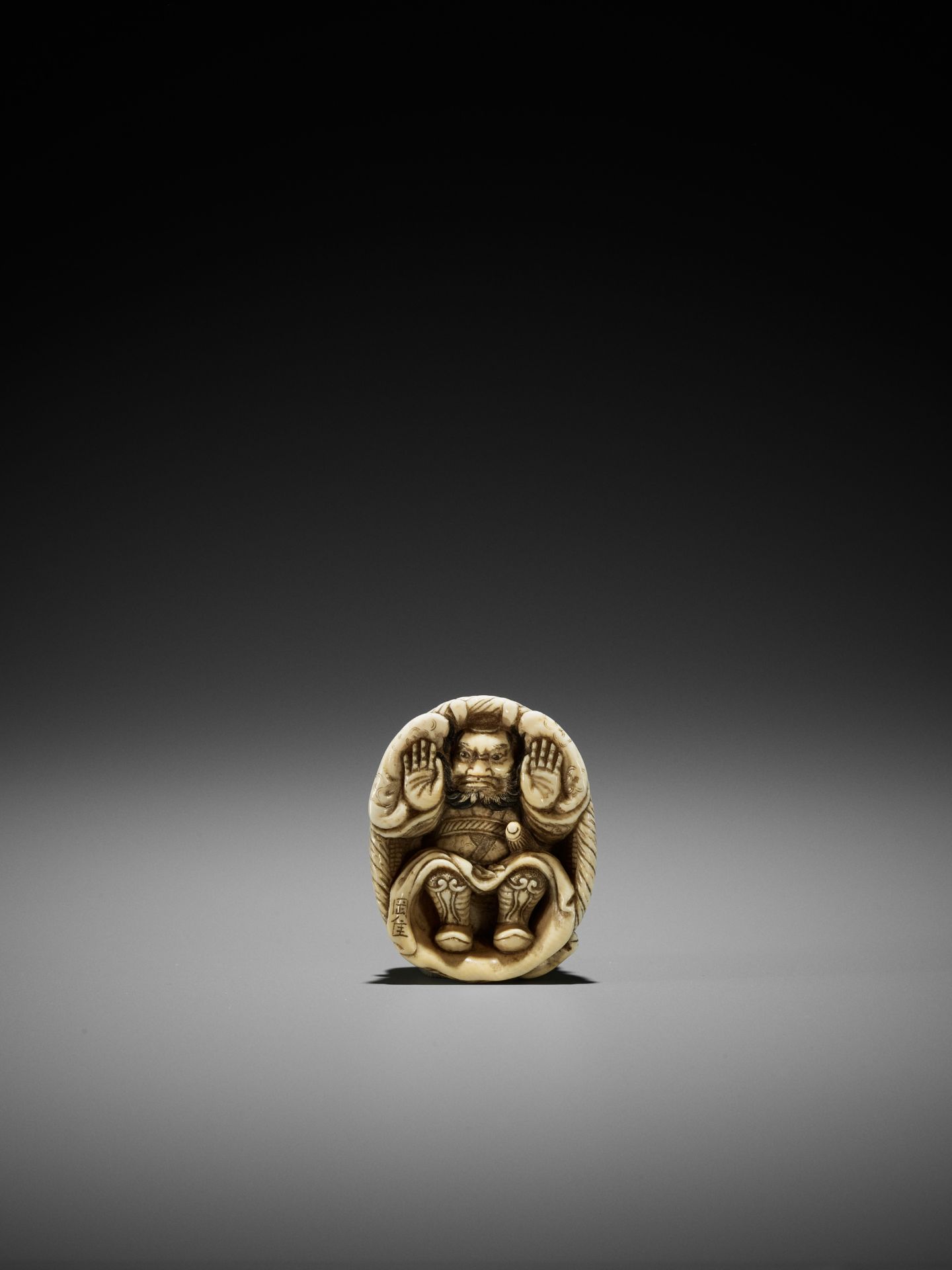 OKATORI: AN IVORY NETSUKE OF AN ONI TRAPPING SHOKI - Image 9 of 12