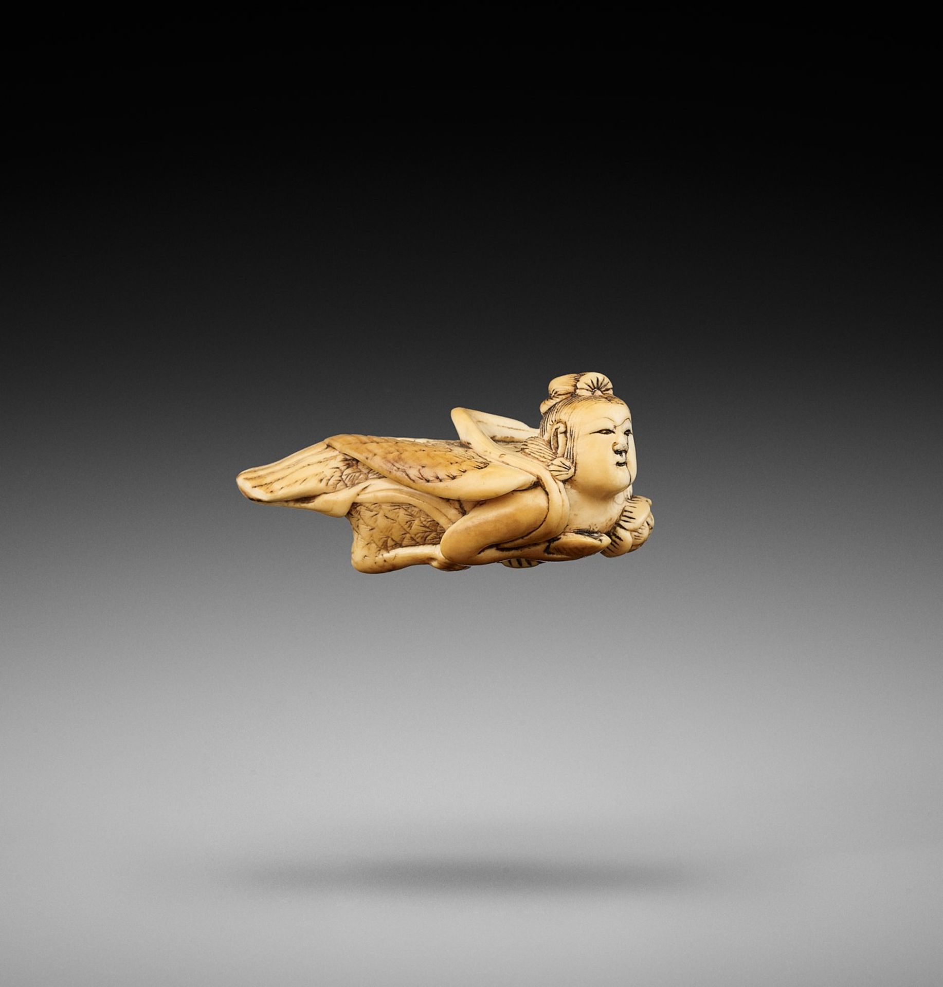 A RARE IVORY NETSUKE OF A KARYOBINGA