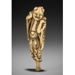 A TALL AND MASSIVE IVORY NETSUKE OF GAMA SENNIN