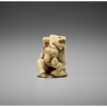 GYOKUSHUN: A MARINE IVORY NETSUKE OF A MONKEY WITH PEACH AND TOAD