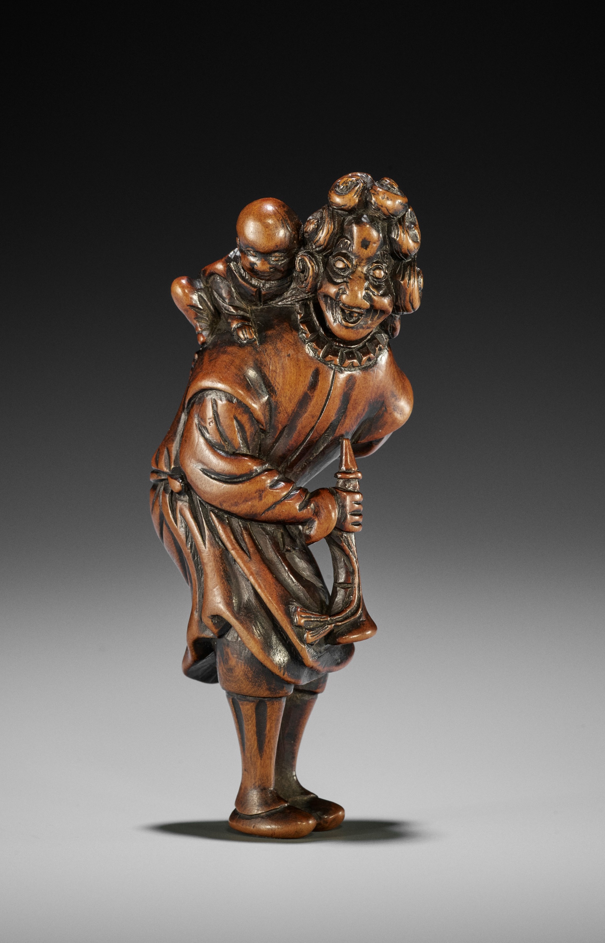 A GOOD WOOD NETSUKE OF A DUTCHMAN