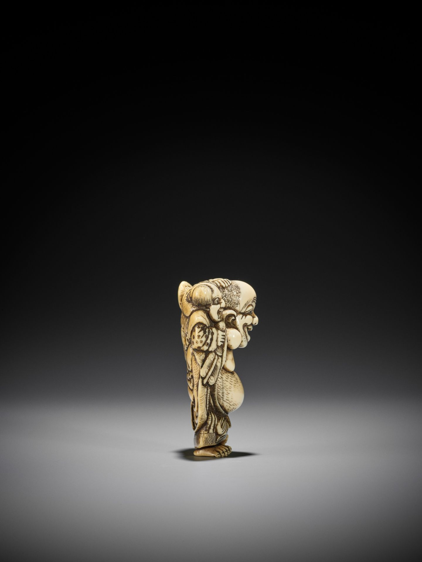 TOZAN: A SUPERB AND LARGE IVORY NETSUKE OF HOTEI WITH KARAKO - Image 9 of 16