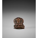 GYOKUZAN: A WOOD NETSUKE OF A MONKEY WITH BIWA (LOQUATS)