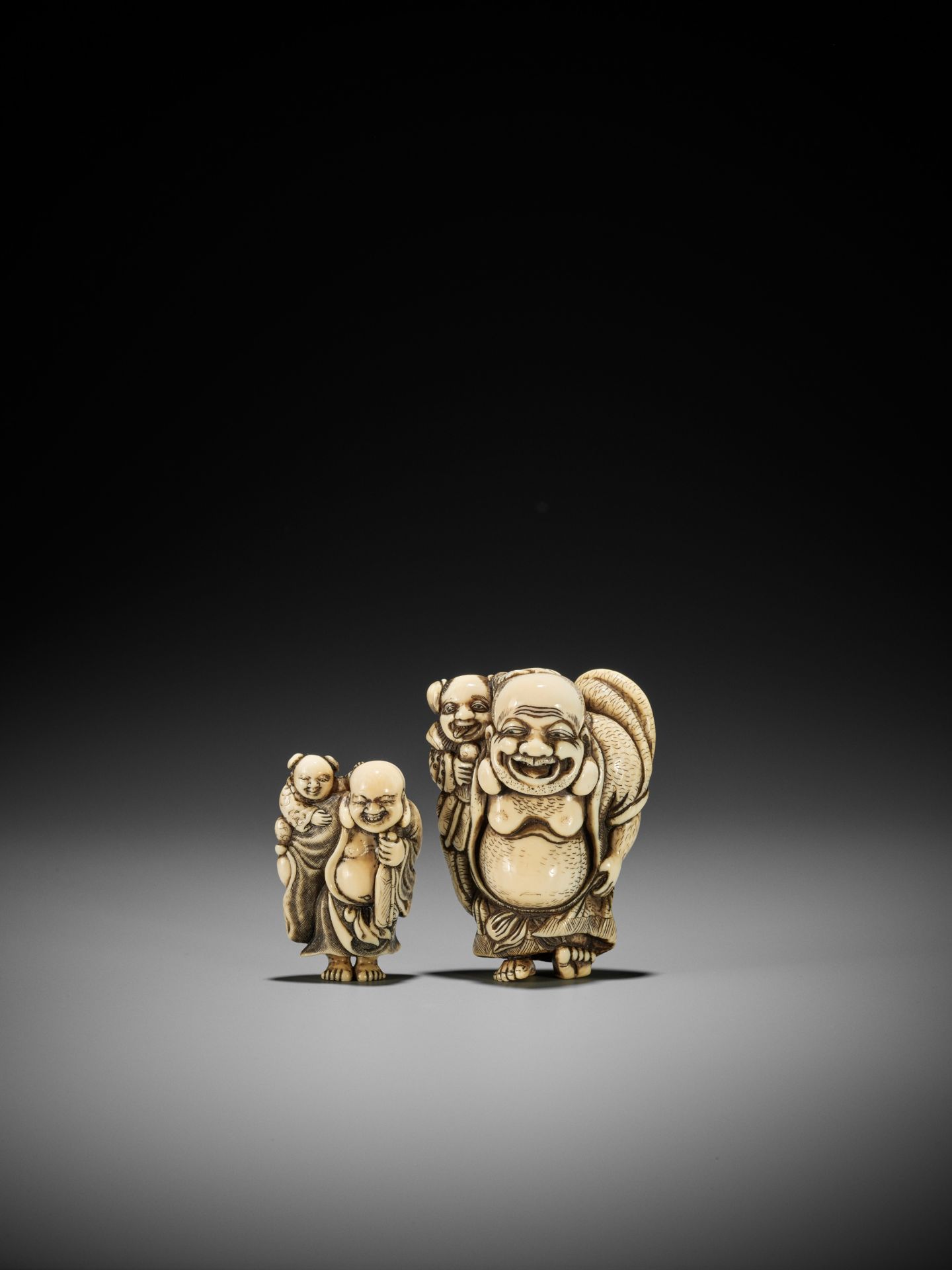 TOZAN: A SUPERB AND LARGE IVORY NETSUKE OF HOTEI WITH KARAKO - Image 6 of 16